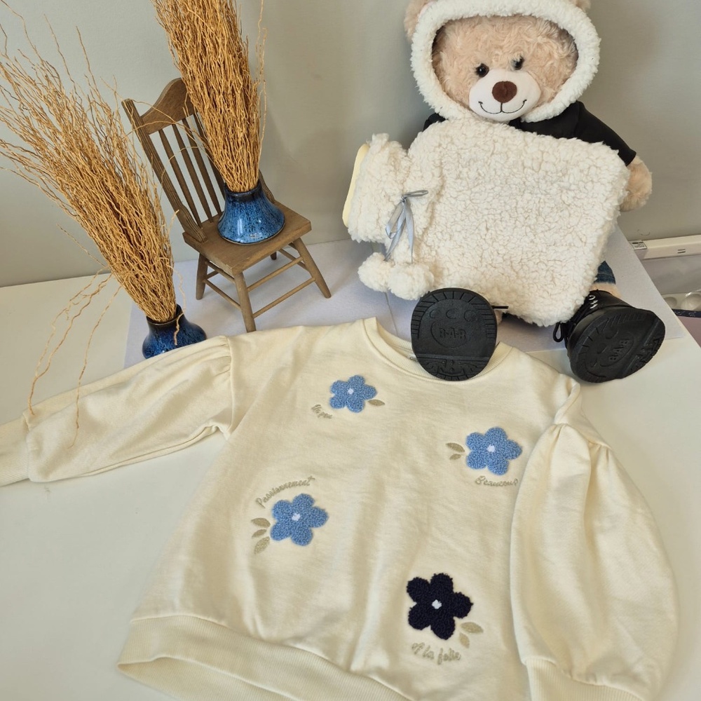 White & Blue Sweater with Floral Detailing
